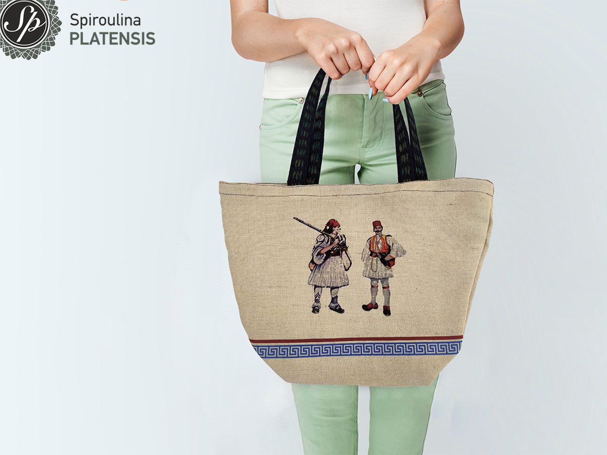 Γυναίκα που κρατάει την τσάντα Εύζωνες